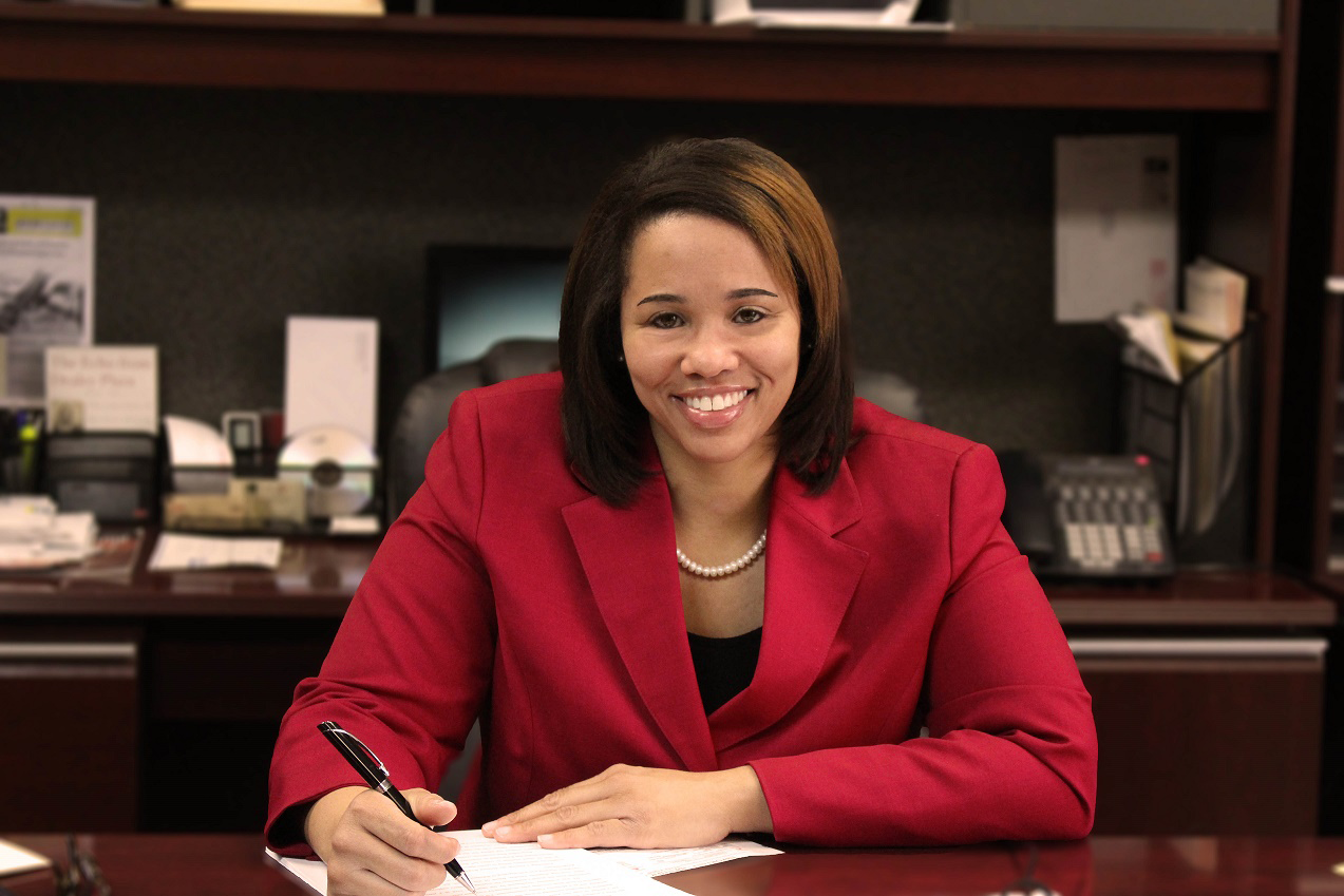 Attorney Helen J. Nowels seated at desk in office